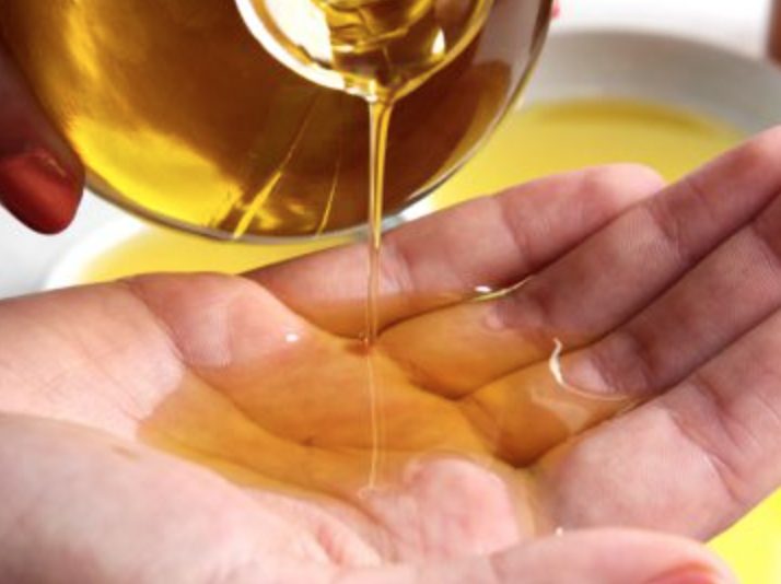 Oil being poured into a hand